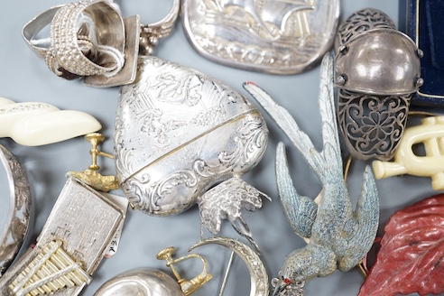 A 19th century 800 white metal heart shaped box, 63mm and a small grouop of other white metal items and costume jewellery.